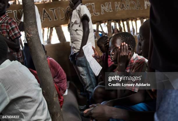Chuol from southern Unity State, attends a Catholic mass on a Sunday alongside other internally displaced in Unity State, South Sudan, September 11,...