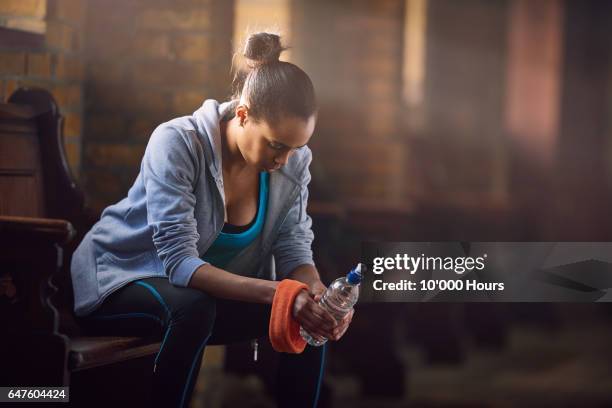 young woman resting in gym. - gym resting stock pictures, royalty-free photos & images