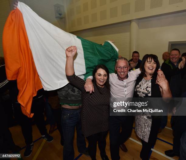 Sinn Fein's Michelle Gildernew , Sean Lynch and Jemma Dolan celebrate winning their three seats in the Fermanagh South Tyrone election as the...