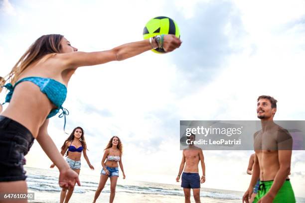 friends enjoying and having fun a beach holiday - beach volley imagens e fotografias de stock