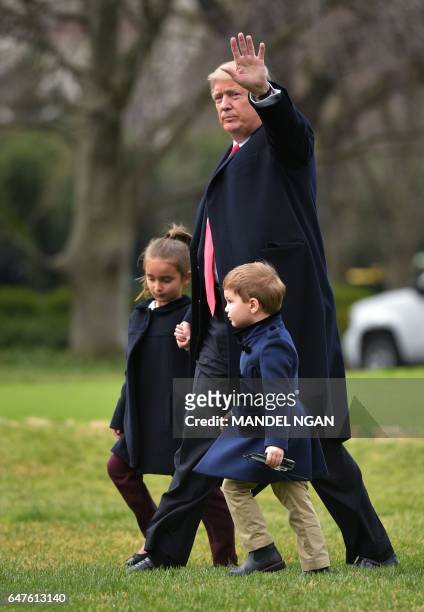 President Donald Trump makes his way to board Marine One with grandchildren Arabella Kushner and Joseph Kushner, from the White House in Washington,...