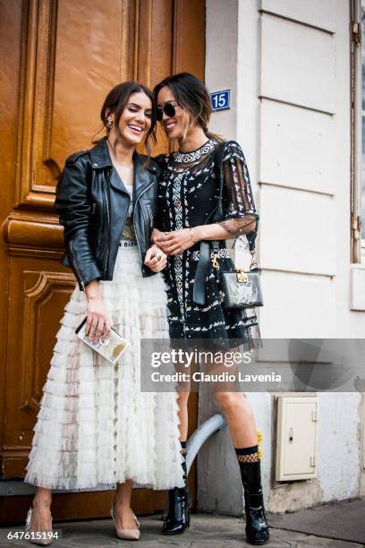 Camila Coelho and Aimee Song are seen in the streets of Paris after the Christian Dior show during Paris Fashion Week Womenswear Fall/Winter...