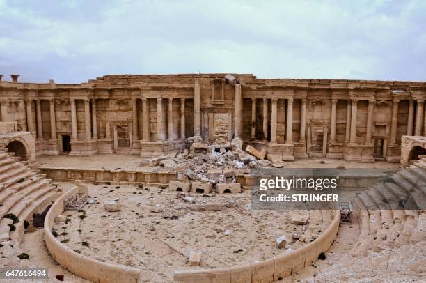 Picture taken on March 3, 2017 shows the damaged Roman amphitheatre in the ancient city of Palmyra in central Syria. Syrian troops backed by Russian...