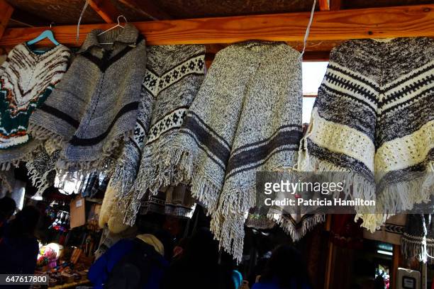 ponchos of llama wool for sale - aysén del general carlos ibáñez del campo stock pictures, royalty-free photos & images
