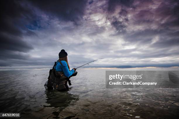 winter sea fishing at møns klint denmark - freshwater fishing stock pictures, royalty-free photos & images