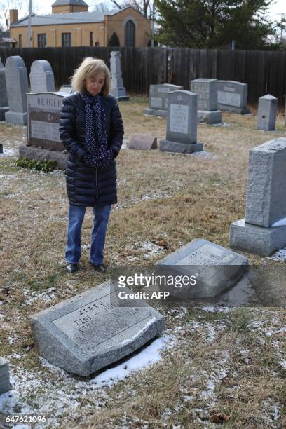 Donna Zack looks at vandalized gravestones at Stone Road or Waad Hakolel Cemetery in Rochester, New York on March 3, 2017. Vandals tumbled and...