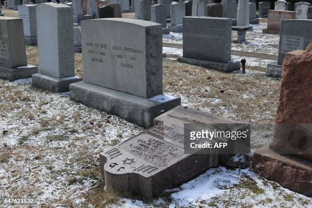 Vandalized stones are scattered at Stone Road or Waad Hakolel Cemetery in Rochester, New York on March 3, 2017. - Vandals tumbled and defaced...