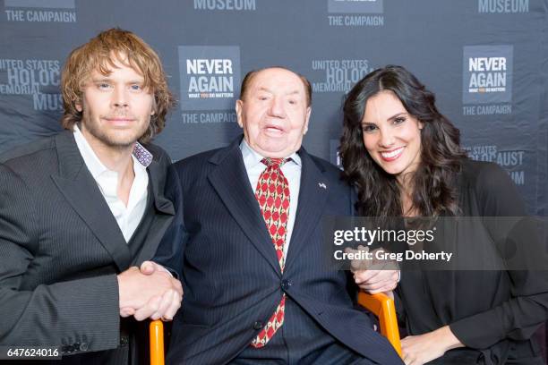 Actors Eric Christian Olsen and Daniela Ruah pose for a picture with Max Webb, a Holocaust Survivor and celebrating his 100th birthday at the United...