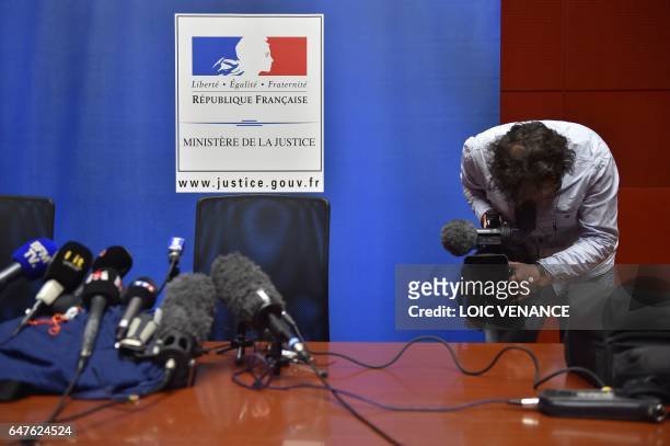 Journalist films before a press conference on the investigations relative to the missing of the four members of the Troadec Family, on March 3, 2017...