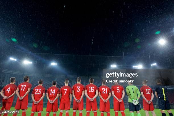 football team standing in a row - football shirt stock pictures, royalty-free photos & images