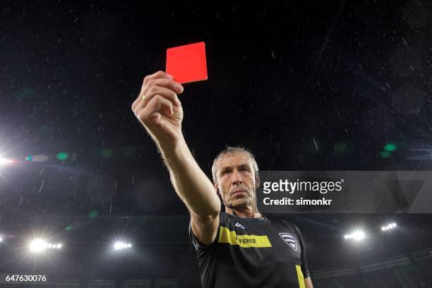referee holds up red card - soccer referee stock pictures, royalty-free photos & images