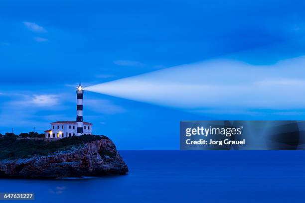 portocolom lighthouse - lighthouse mallorca stock pictures, royalty-free photos & images