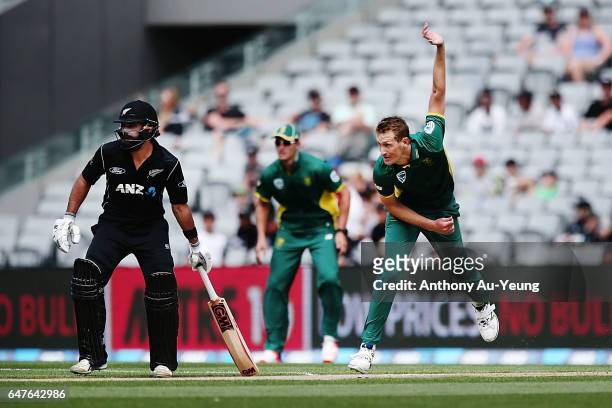 Chris Morris of South Africa bowls as Dean Brownlie of New Zealand looks on during game five of the One Day International series between New Zealand...