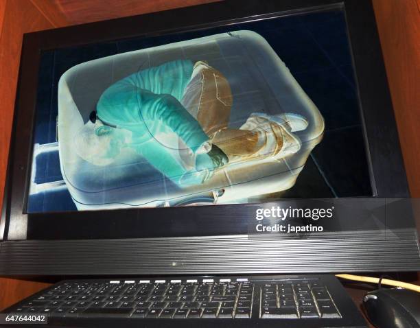 illegal immigrant detected at an airport on an x-ray machine - immigrants crossing sign bildbanksfoton och bilder