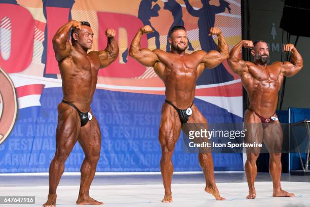 Hidetada Yamagishi , Zane Watson , Guy Cisternino compete in the Arnold Classic 212 as part of the Arnold Sports Festival on March 3 at the Greater...
