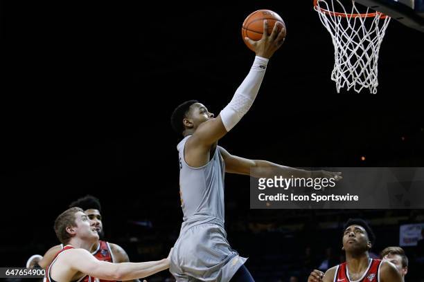 Toledo Rockets guard Jonathan Williams goes in for a layup during a regular season basketball game between the Ball State Cardinals and the Toledo...