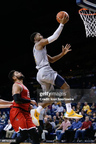 Toledo Rockets guard Jonathan Williams goes in for a layup during a regular season basketball game between the Ball State Cardinals and the Toledo...