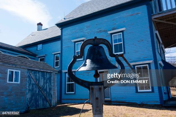 Bell is mounted along the shore near some of the old homes March 3, 2017 in Lubec, Maine. Lubec is the easternmost town in the contiguous United...