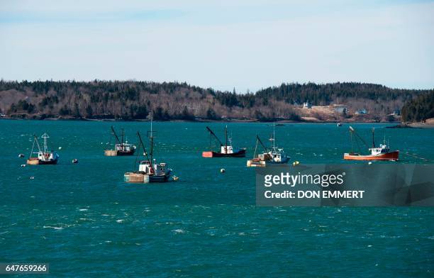 Fishings boats are moored off the shore onMarch 3, 2017 in Lubec, Maine. Lubec is the easternmost town in the contiguous United States with a border...