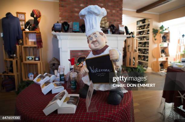 Shoppers are greeted by a chef statue at Monica's Chocolates March 3 in the US/Canada border town of Lubec, Maine. Lubec is the easternmost town in...