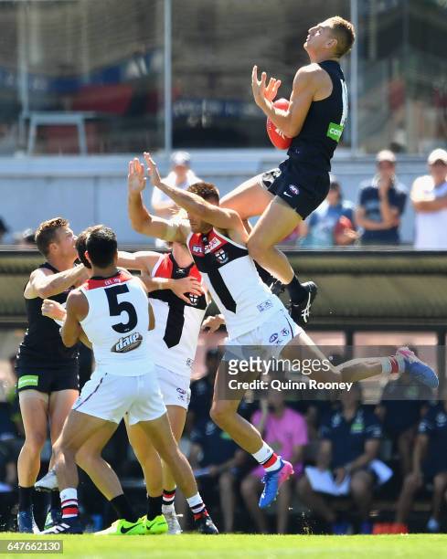 Liam Jones of the Blues marks over the top of Nathan Brown of the Saints during the 2017 JLT Community Series AFL match between the Carlton Blues and...