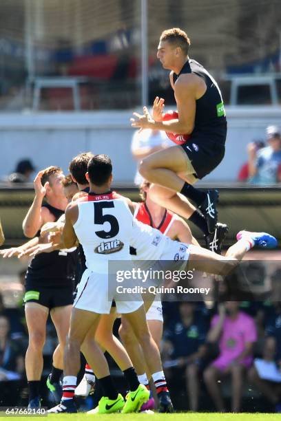 Liam Jones of the Blues marks over the top of Nathan Brown of the Saints during the 2017 JLT Community Series AFL match between the Carlton Blues and...