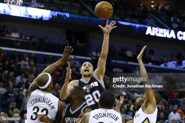 Manu Ginobili of the San Antonio Spurs shoots over Dante Cunningham of the New Orleans Pelicans, Hollis Thompson and Tim Frazier during the first...