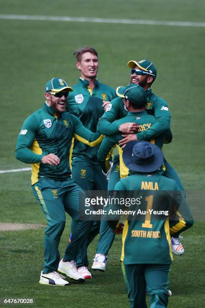 Duminy of South Africa celebrates with teammates for the wicket of Mitchell Santner of New Zealand during game five of the One Day International...