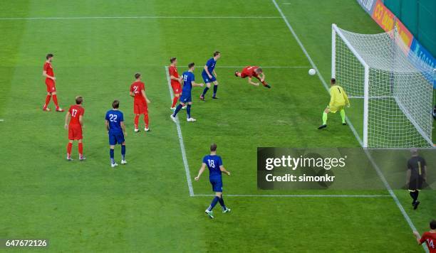 soccer players heading - scoring goal stock pictures, royalty-free photos & images