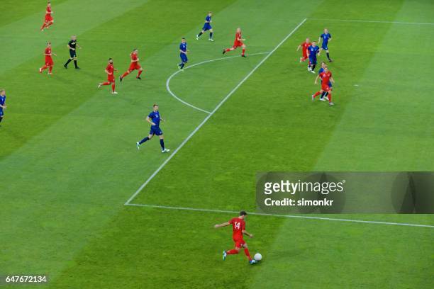 football players playing football - sports round stock pictures, royalty-free photos & images