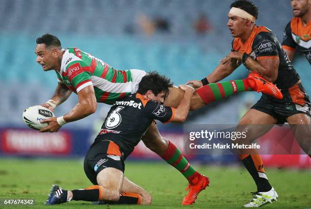 John Sutton of the Rabbitohs passes during the round one NRL match between the South Sydney Rabbitohs and the Wests Tigers at ANZ Stadium on March 3,...