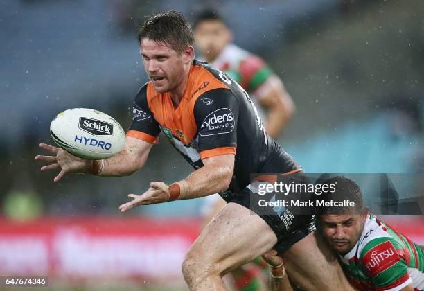 Chris Lawrence of the Tigers passes during the round one NRL match between the South Sydney Rabbitohs and the Wests Tigers at ANZ Stadium on March 3,...