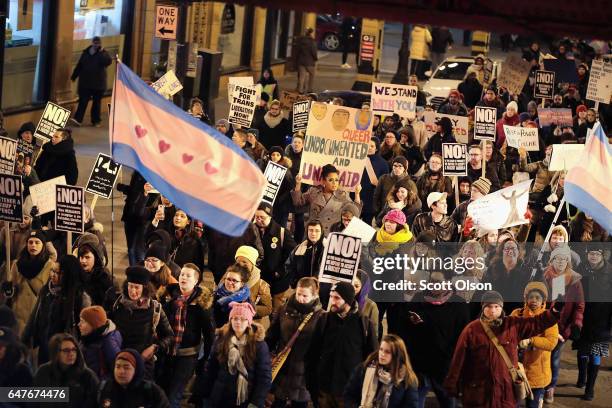 Demonstrators protest for transgender rights with a rally, march through the Loop and a candlelight vigil to remember transgender friends lost to...