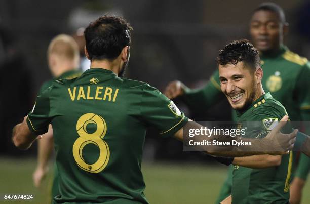 Diego Valeri celebrates with Sebastian Blanco of Portland Timbers after scoring a goal during the second half of the match against the Minnesota...