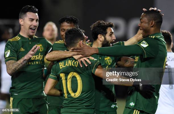 Liam Ridgewell, Sebastian Blanco, Diego Valeri and Fanendo Adi celebrate after Valeri scored a goal during the second half of the match against the...