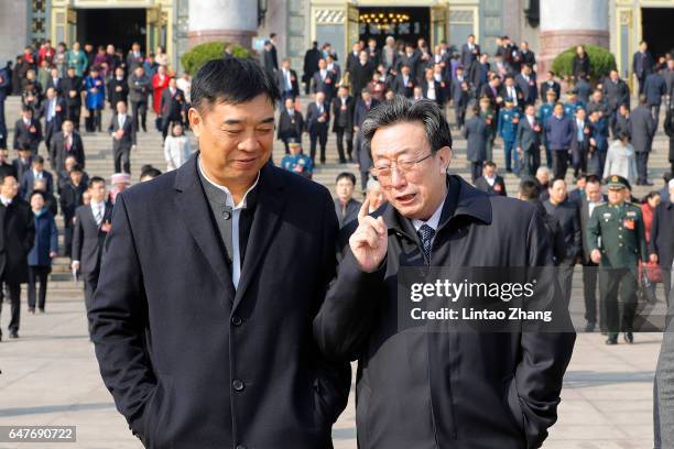 Guo Gengmao, former Secretary of the Henan Committee walks out the Great Hall of the People after plenary session of the National People's Congress...