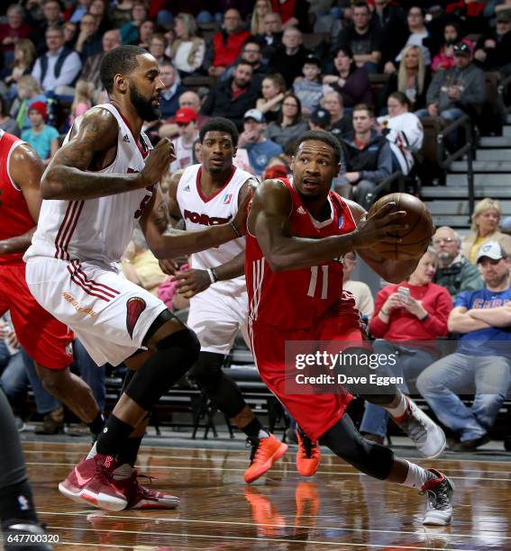 Demetrius Jackson from the Maine Red Claws drives past Keith Benson from the Sioux Falls Skyforce at the Sanford Pentagon March 3, 2017 in Sioux...