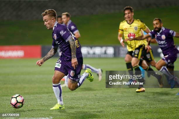 Adam Taggart of Perth takes the ball forward during the round 22 A-League match between the Wellington Phoenix and the Perth Glory at QBE Stadium on...