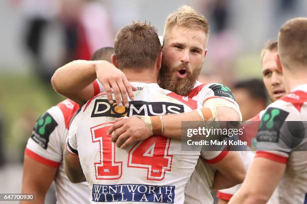 Tariq Sims and Jack de Belin of the Dragons celebrate victory during the round one NRL match between the St George Illawarra Dragons and the Penrith...