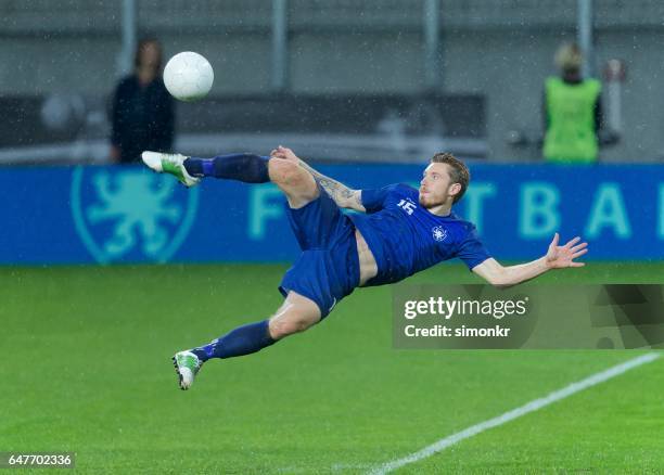 bicycle kick - bicycle kick stock pictures, royalty-free photos & images