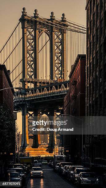 manhattan bridge and empire state building at dawn - arch bridge stock pictures, royalty-free photos & images