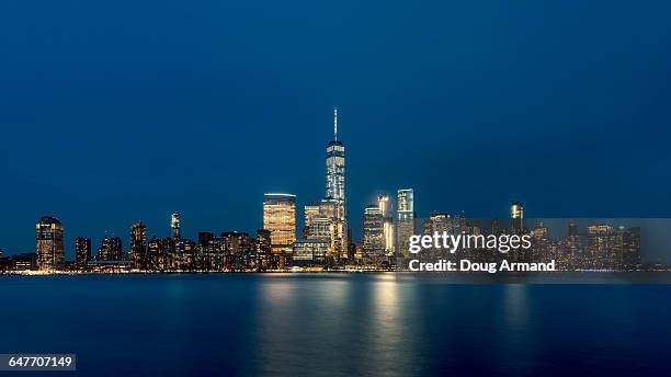 lower manhattan skyline at night, new york, usa - world trade center manhatten stock pictures, royalty-free photos & images