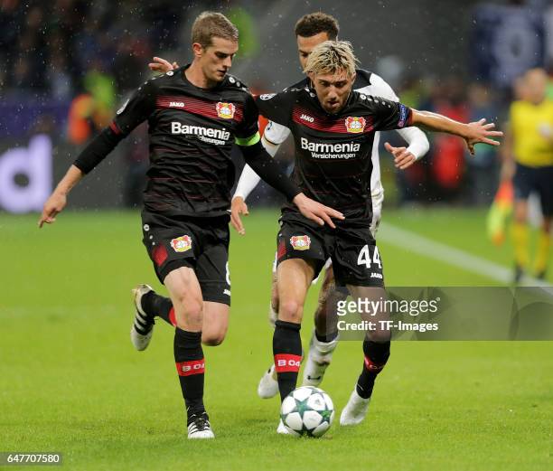 Kevin Kampl of Leverkusen and Dele Alli of Tottenham and Lars Bender of Leverkusen battle for the ball during the UEFA Champions League group E...