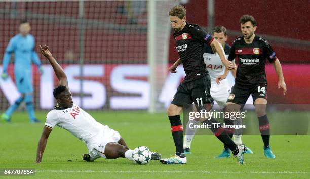 Victor Wanyama of Tottenham and Stefan Kießling of Leverkusen and Admir Mehmedi of Leverkusen battle for the ball during the UEFA Champions League...