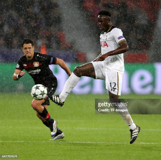Javier Hernandez of Leverkusen and Victor Wanyama of Tottenham battle for the ball during the UEFA Champions League group E soccer match between...