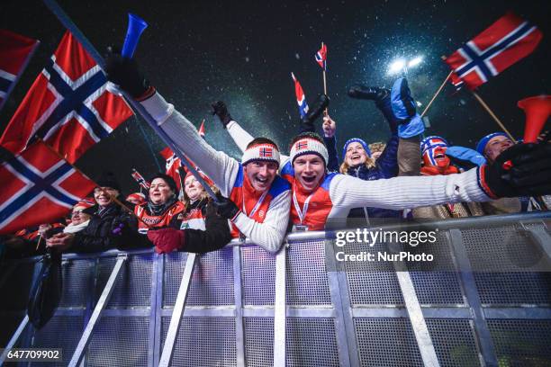 Norwegian fans celebrate their team's Gold medal in Men cross-country 4 x 10.0km Relay during the Awards Ceremony, at FIS Nordic World Ski...