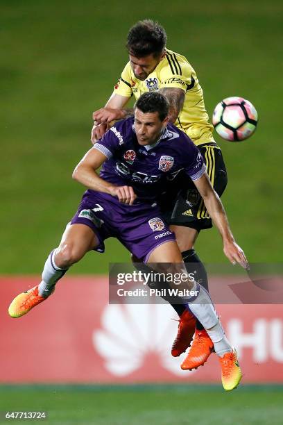 Joel Chianese of Perth and Thomas Doyle of Wellington header the ball during the round 22 A-League match between the Wellington Phoenix and the Perth...