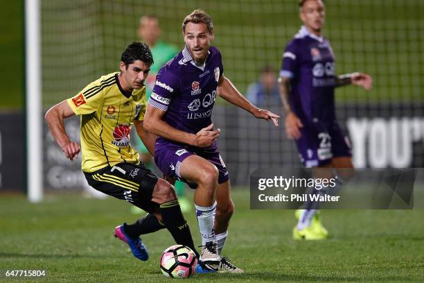 Guliherme Finkler of Wellington and Rostyn Griffiths of Perth compete for the ball during the round 22 A-League match between the Wellington Phoenix...
