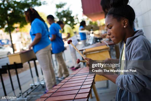 Kamille Coleman right, plays the xylophone. Sixth grade students from E.L. Haynes Public Charter School entertain passersby on Georgia Ave. NW during...