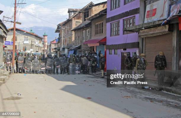 The Indian troopers blocks road to thwart protests to move ahead during the protest in old city Srinagar. The protest was held against the Zakoora...